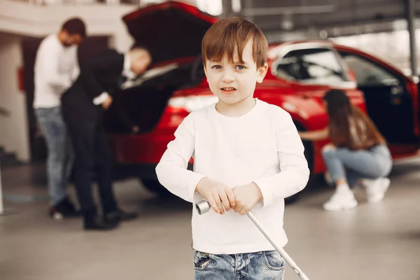 Family with little son in a car salon — Photo