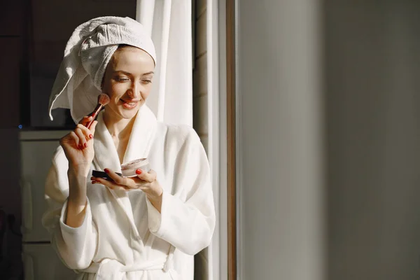 Girl in a bathrobe and towel on her head — Stock Photo, Image