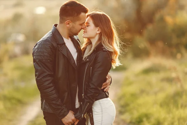 Beautiful couple spend time on a summer field — Stock Photo, Image