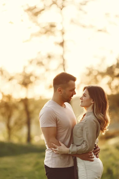 Beautiful couple spend time on a summer field — Stock Photo, Image