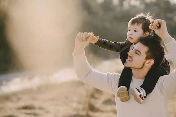 Cute family playing in a autumn field — Stock Photo, Image