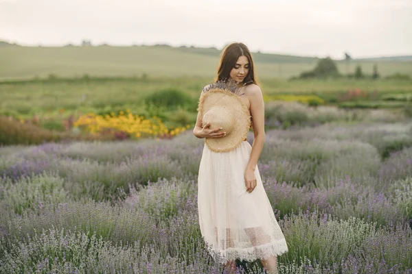 Woman without bra standing in a lavender field — Stock Photo, Image