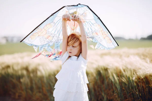 Cute child spend time on a summer field — Stock Photo, Image