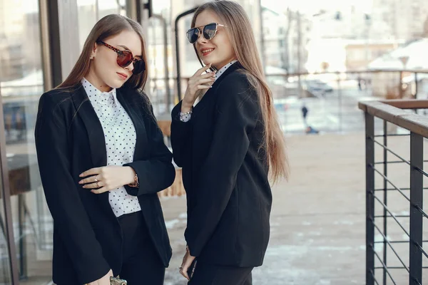 Twins with phone — Stock Photo, Image