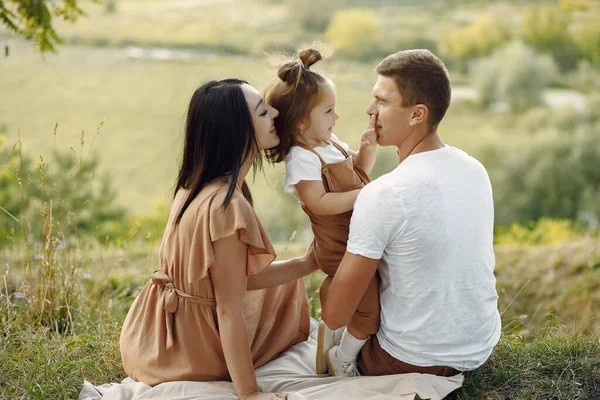 Cute family playing in a autumn field — Stock Photo, Image