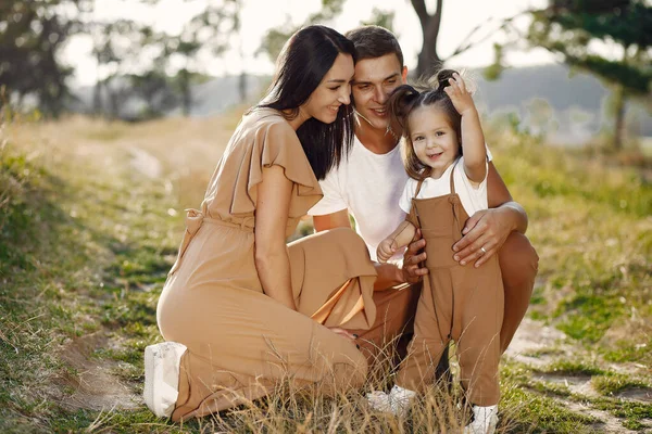 Cute family playing in a autumn field — Stock Photo, Image