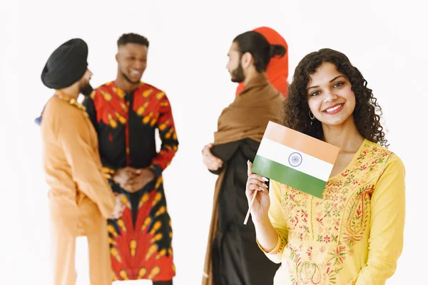 Group of diverse smiling men wearing in folk costumes — Stock Photo, Image