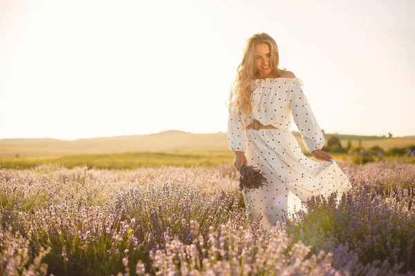 Woman in a white dress in a lavender field — Stock Photo, Image