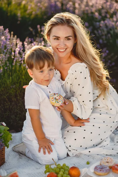 Little boy with her mother in a lavender field — Stock Photo, Image