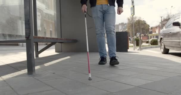 Unrecognizable blind man walking alone in the city — Stock Video