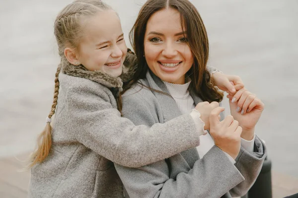 Cute and stylish family in a autumn park — Stock Photo, Image