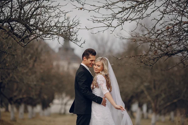 Bride walking in golden autumn nature — Stock Photo, Image