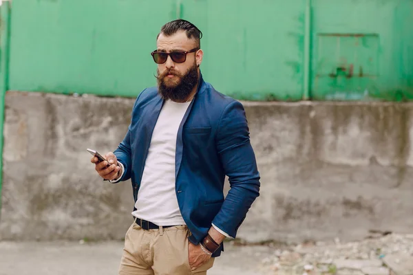 Lone bearded man who looks like a millionaire — Stock Photo, Image