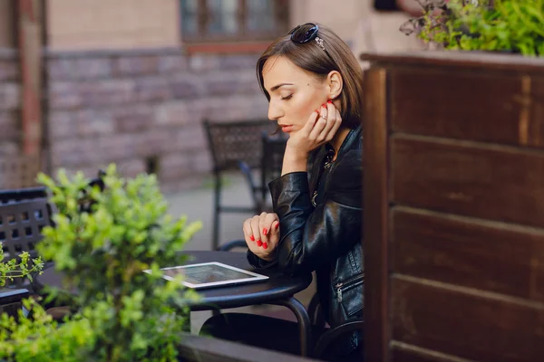 Beautiful girl enjoys gadgets — Stock Photo, Image