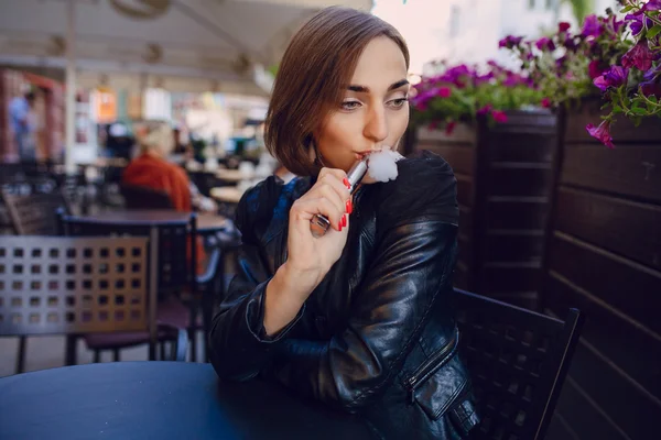 Beautiful glamorous brunette smoke electronic cigarette — Stock Photo, Image