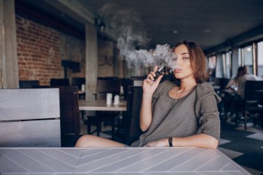 Girl with E-cigarette clipart