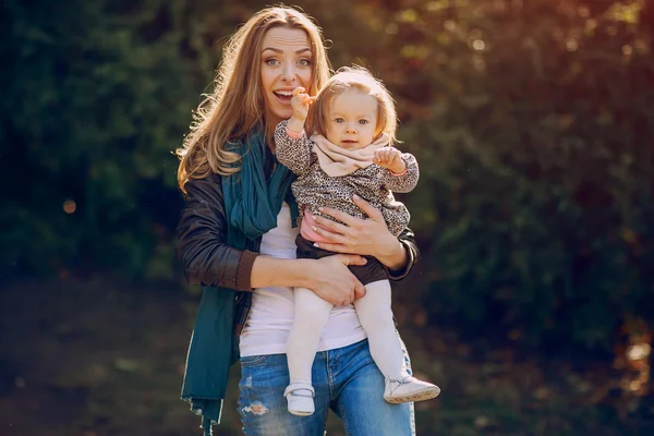 Young family walking in the park — Stock Photo, Image