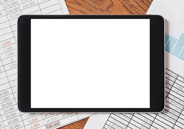 Tablet with blank background on your desktop with documents, reports and graphs. Business and finance concept