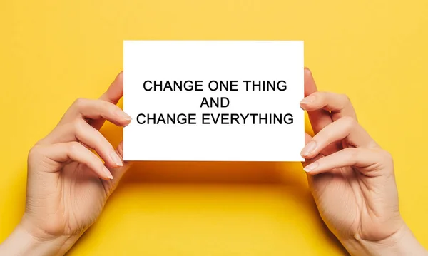 Female Hands Hold Card Paper Text Change One Thing Change — Stock Photo, Image