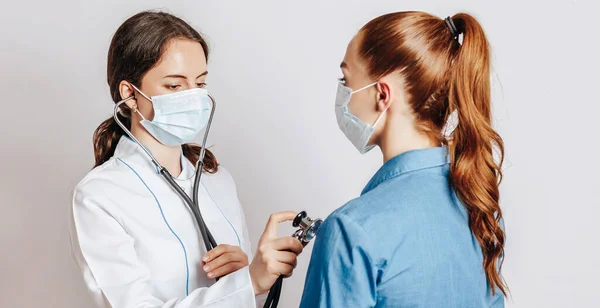 Doctor Checking Health Woman Patient Masks Stethoscope White Isolated Background — Stock Photo, Image