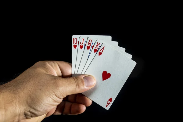 Hand holding a royal flush — Stock Photo, Image