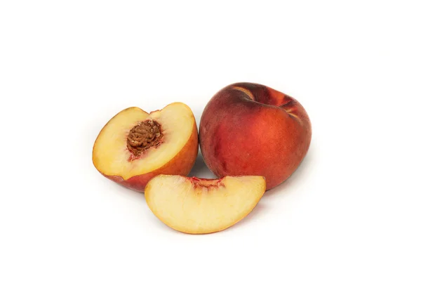 A peach, a half and a quarter — Stock Photo, Image