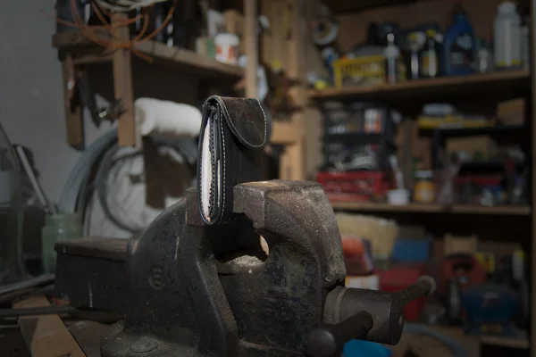 Money clamped in a vise — Stock Photo, Image