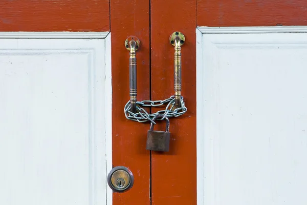 Close up old wooden door with lock — Stock Photo, Image