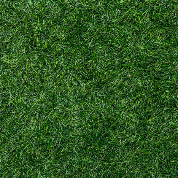 Kunstmatige grasveld voor achtergrond en textuur — Stockfoto