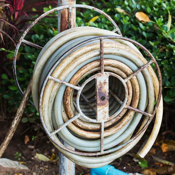 Old water hose on the hanging. — Stock Photo, Image