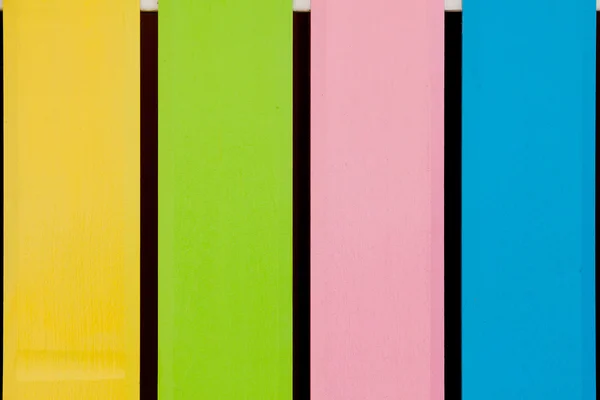 Muitas cores de madeira close-up, fundo — Fotografia de Stock
