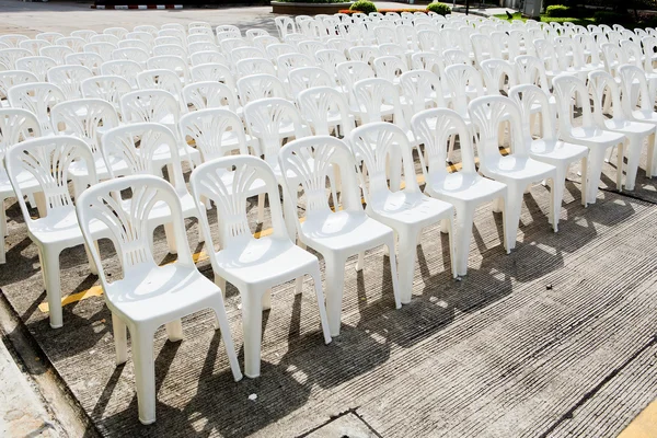 White plastic chairs in celebration and outdoor event — Stock Photo, Image