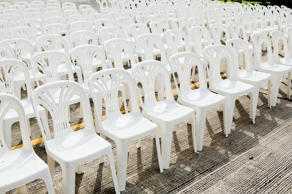 White plastic chairs in celebration and outdoor event — Stock Photo, Image