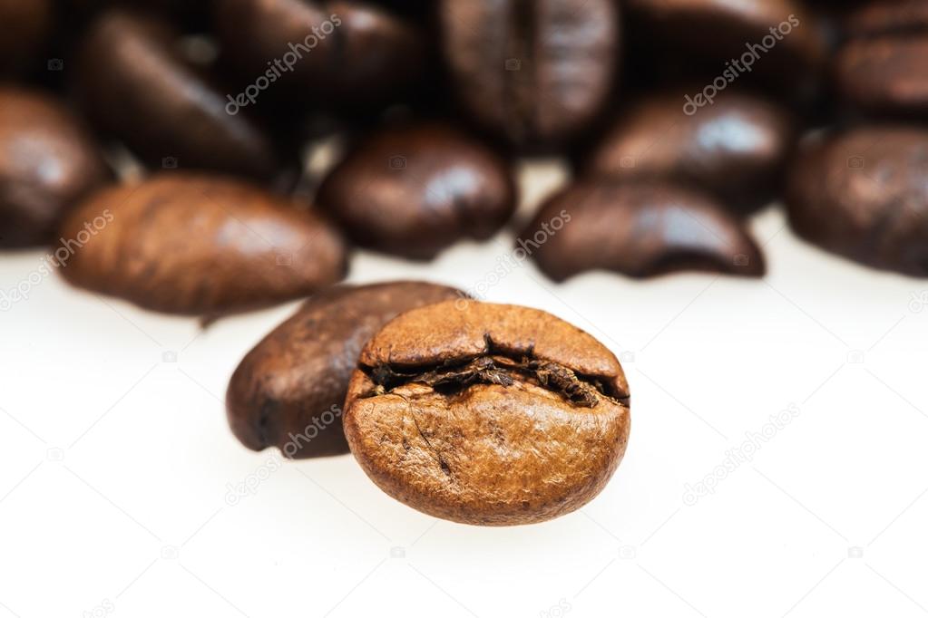 Heap of coffee beans on the table