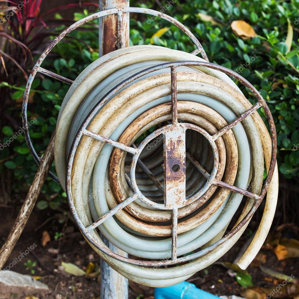 depositphotos_66204315-stock-photo-old-water-hose-on-the.jpg