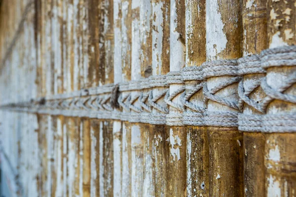 Bamboo panel with a rope tied. — Stock Photo, Image