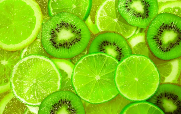 Grønn skive av kalk og kiwi-bakgrunn – stockfoto