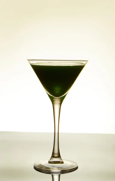 Dark-green cocktail on light background — Stock Photo, Image