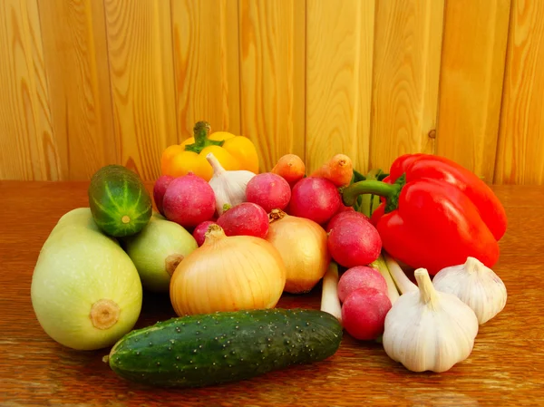 Set fresh vegetables on wooden table Royalty Free Stock Images