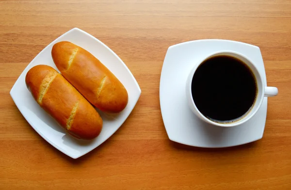 French bread rolls and coffee — Stock Photo, Image