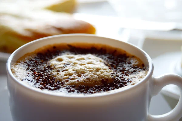 Morning cappuccino and bun — Stock Photo, Image