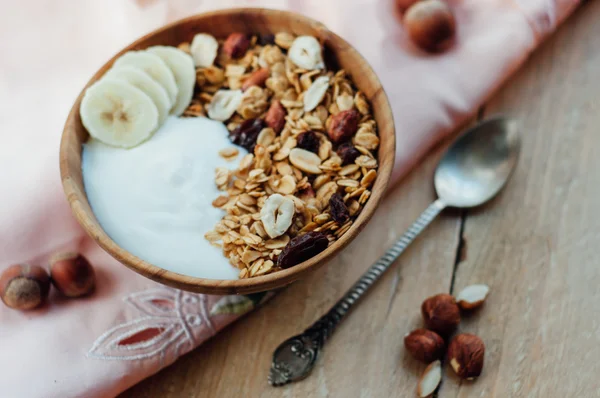 Homemade oatmeal granola with peanuts, blueberry and banana