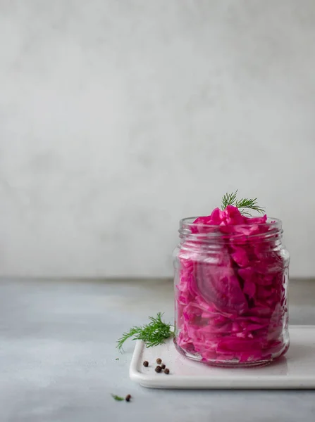 Sauerkraut with beets in a jar. fermented food. vertical image. Gray background — Stock Image Sauerkraut with beets in a jar. fermented food. vertical image. Gray background Royalty Free Stock Photos