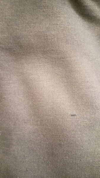 Hafif çizgisel desenli eski açık kahverengi kağıt veya mukavvanın yüzey dokusu.