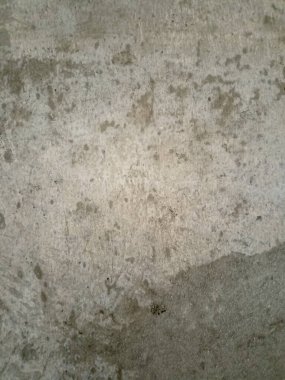 Düz gri çimento ya da alçı yüzey dokusu, tamamlanmamış, çalışmanın hafif izlerini gösteriyor.