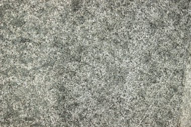 Pürüzlü gri granit taş dokusu, siyah, beyaz ve açık gri tanelerin karışımı yoğun bir mineral arkaplan oluşturur..