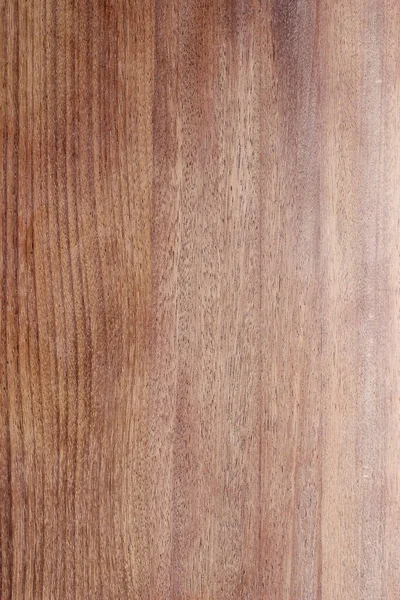 Natural wood texture with vertical grain, featuring light to reddish brown color variations, suitable for interior design or furniture background.