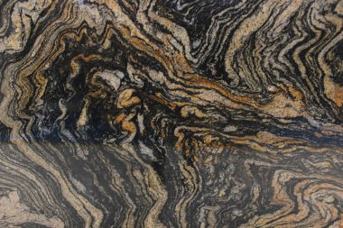 Brezilya 'dan Magma Gold granit desenli dramatik siyah ve altın dalga desenli, lüks iç tasarım için uygun..
