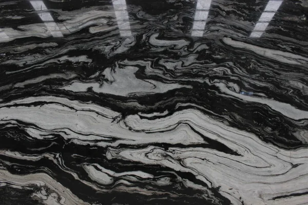 Beyaz panda mermer dokusu Çin 'den geliyor. Siyah ve beyaz damarlar dinamik bir şekilde akıyor..