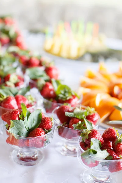 Strawberries in a glass bowl on the white table — Stock Photo, Image